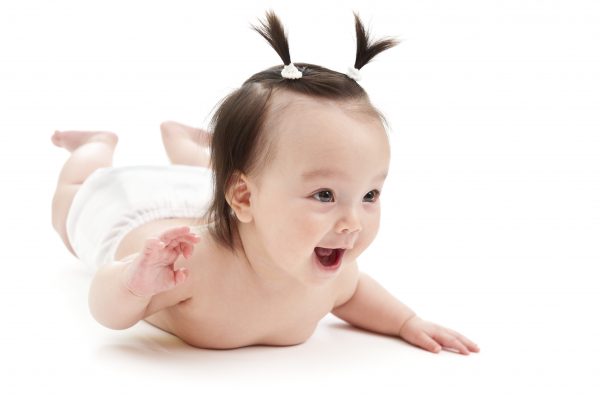 happy baby with two pigtails